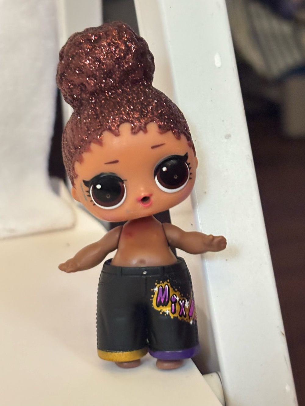 L.O.L. Surprise! Doll with Brown Glitter Bun and Black Pants